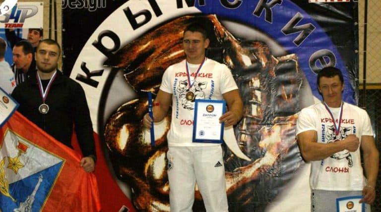 Artem Taynov - 90 kg class winner - Crimean Armwrestling Championship 2014 │ Photo Source: Andrey Sharkoff [edited by XSportNews]
